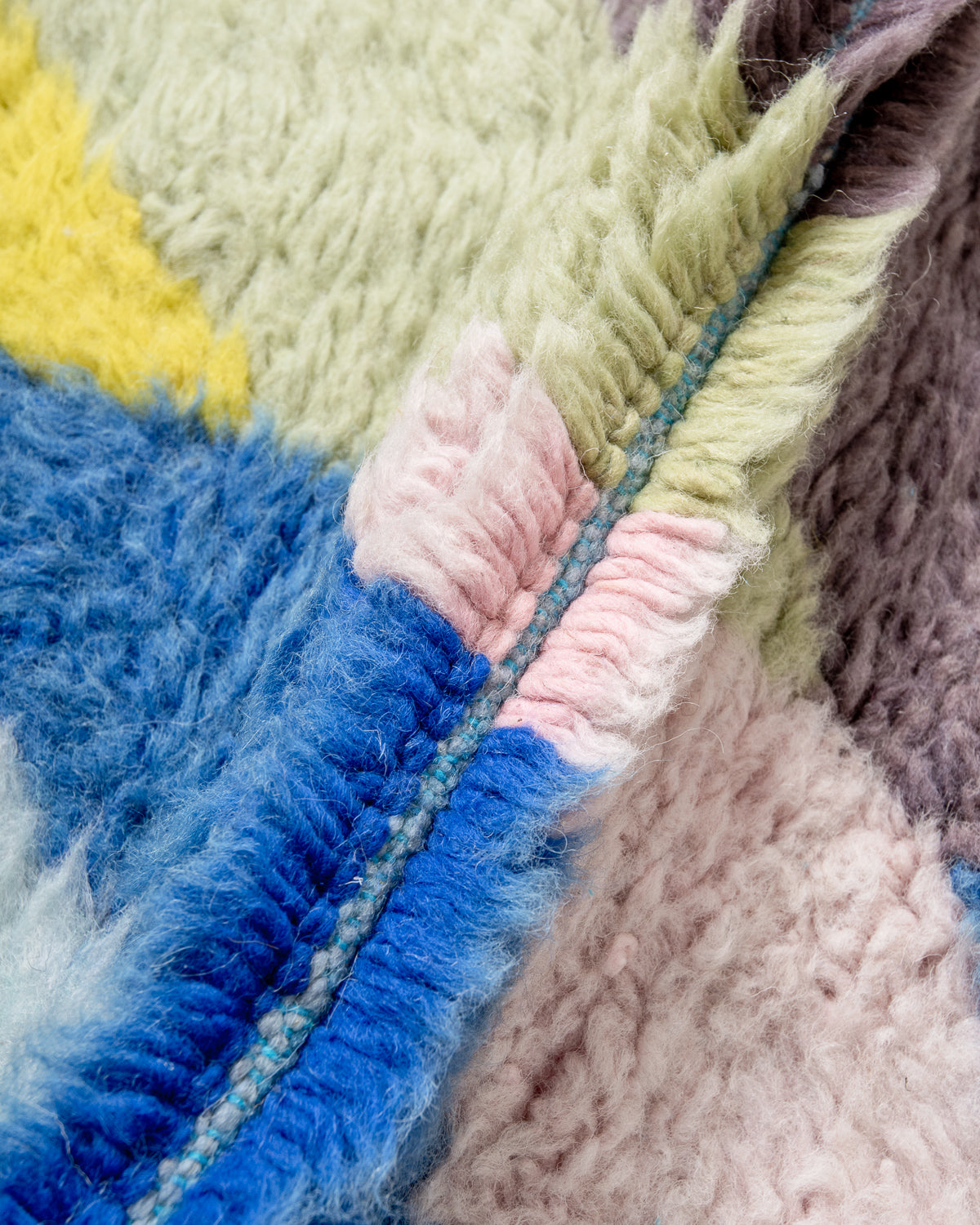 Modern, designer, handcrafted Berber rug from Morocco. Beniourain carpet with beautiful colours and patterns and fluffy wool texture.